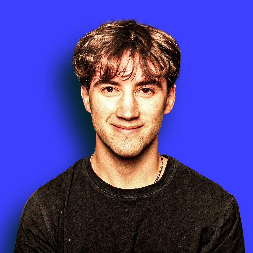 Drake Surach, photographed on camera against the AI Foundations blue